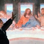Professor Paul Crenshaw pointing toward a large projection of Leonardo da Vinci's 
